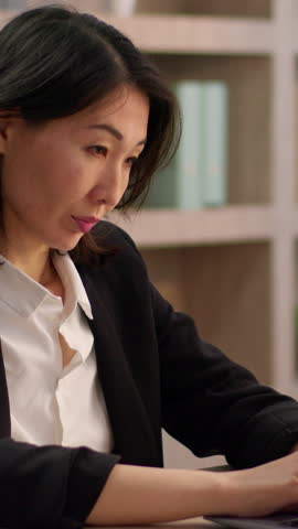 Tired Asian businesswoman typing laptop feeling eyes discomfort Chinese business woman working computer suffering blurry view eyesight Korean female Japanese lady suffer headache migraine in office