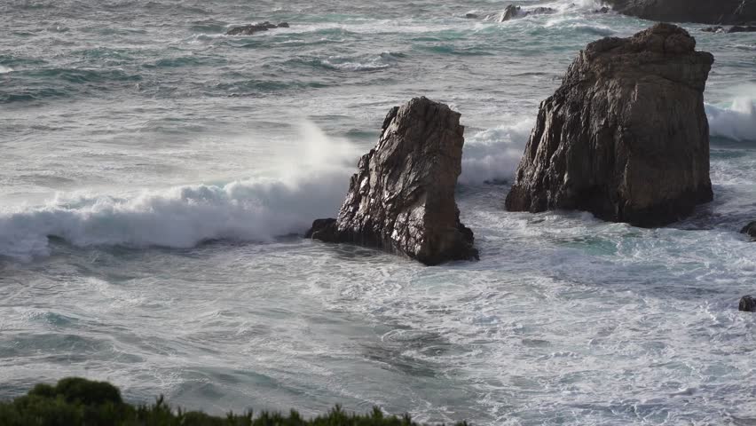 Majestic Ocean Waves Crashing on Rocky Shoreline.