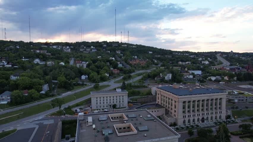 Aerial of downtown Duluth Minnesota at dusk.  Approach shot of residential area on hillside.