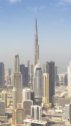 Timelapse of the dubai skyline from a high vantage point in vertical