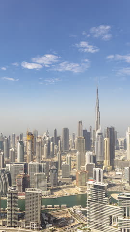 Timelapse of the dubai skyline from a high vantage point in vertical