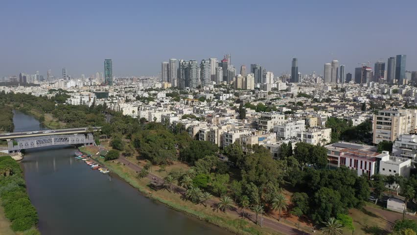 Aerial View of Yarkon River and Park with Tel Aviv Cityscape and Skyscrapers, Israel