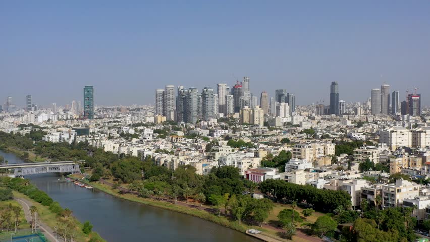Aerial View of Yarkon River and Park with Tel Aviv Cityscape and Skyscrapers, Israel