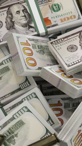 stack of  dollars and  bullets