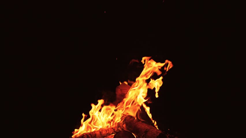 Slow Motion of Camp Fire Isolated on Black Background. Burning Wooden Logs on Black Background. VFX Effect Ideal for Overlay.