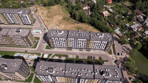 Aerial Orbit above Apartment Building Roofs