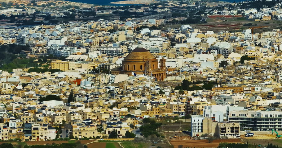 Aerial view of Mosta Church, famous remarkable wartime miracle, architectural landmarks, Malta 