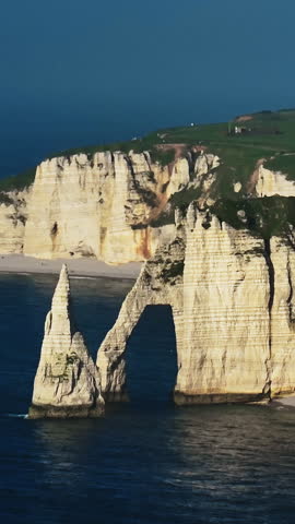 Aerial view of picturesque coastal limestone cliffs. Etretat, France