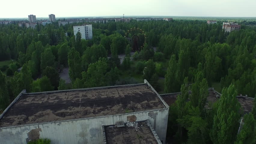 Aerial view of abandoned Pripyat city, iconic Ferris wheel, decaying buildings. Chernobyl.