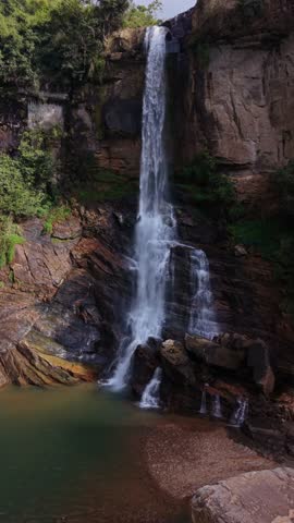 Vertical drone flight above Ramboda falls in Sri Lanka