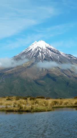 Mount Taranaki Snow-Capped Peak with Pouakai Tarn In New Zealand, Timelapse Vertical View