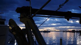 Drum and hauler of a fishing boat, at night, Santa Pola port, Spain. - Powered by Shutterstock - Get 15% off with code: PIKWIZARD15