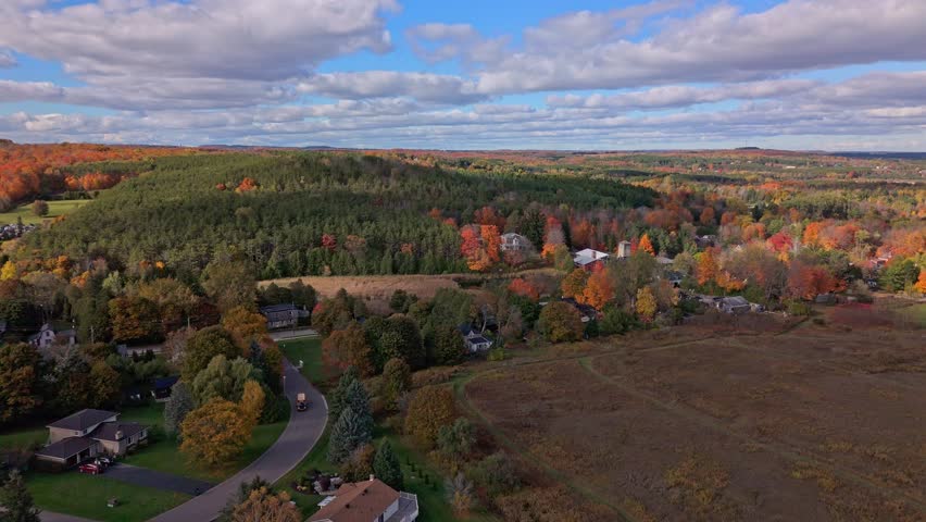 Aerial Flyover Of Autumn Colours During Fall In The Town Of Alton In Caledon, Ontario, Canada.