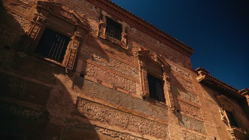 Stone archway entrance leading into historic city street
