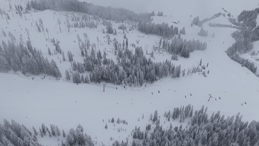 Drone footage of ski runs in Königsleiten and Krimml, showing expansive alpine terrain and freshly groomed slopes in Austria’s scenic mountains.