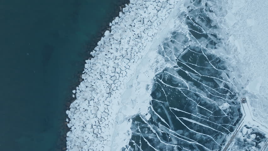Aerial view of icy Bronte Harbour on Lake Ontario in winter