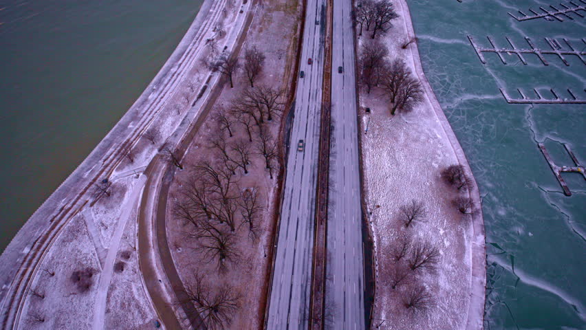 Atmospheric sunrise aerial of the Loop district with Lake Michigan and skyline.
