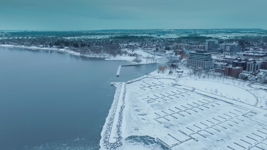 Snowy Bronte Harbour view with Lake Ontario in winter serenity