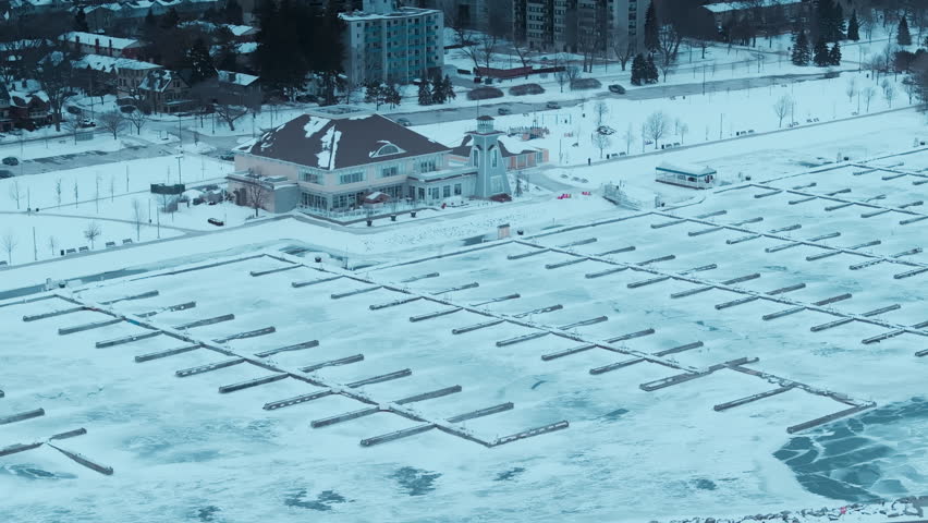 Snowy Bronte Harbour and Lake Ontario in winter, serene and cold atmosphere