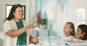 Teacher and kids watching teacher starting STEM demo in class with bins, bottles to learn science. Classroom, students, instructor, demonstration, experiment, engagement, poster - Powered by Shutterstock - Get 15% off with code: PIKWIZARD15