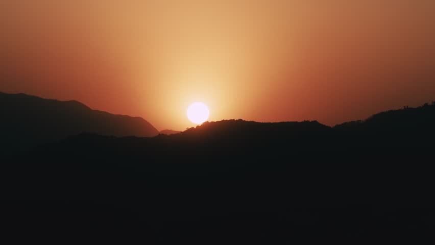 Aerial Drone View of Sunset over Mountains in Kathmandu, Nepal Skyline and Buildings