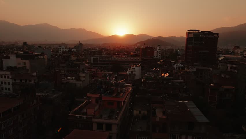 Aerial Drone View of Kathmandu at Sunset, Flying over Nepal Skyline and Buildings