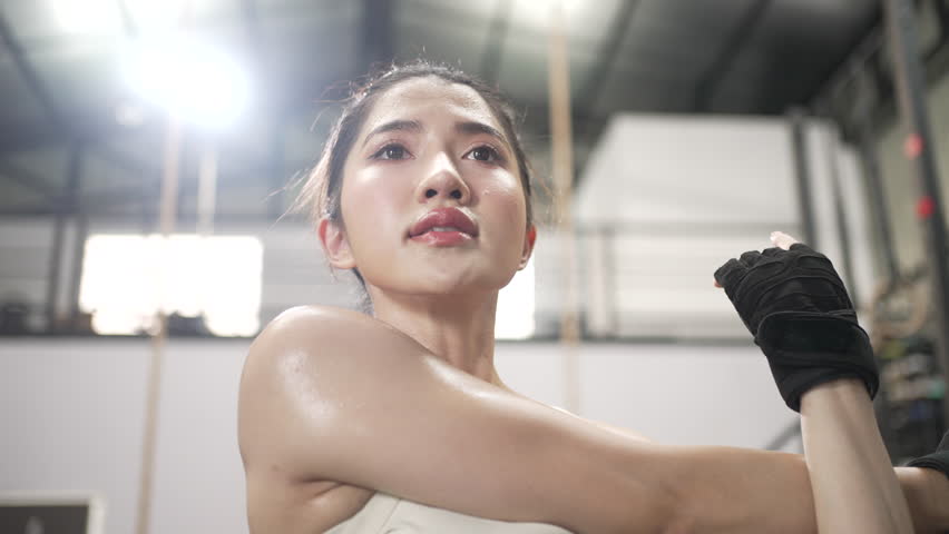 Pretty woman is exercising at a fitness center. Sports, Health care, exercise.