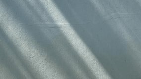 The shadows from the trees were reflected on the concrete wall in diagonal beams. - Powered by Shutterstock - Get 15% off with code: PIKWIZARD15