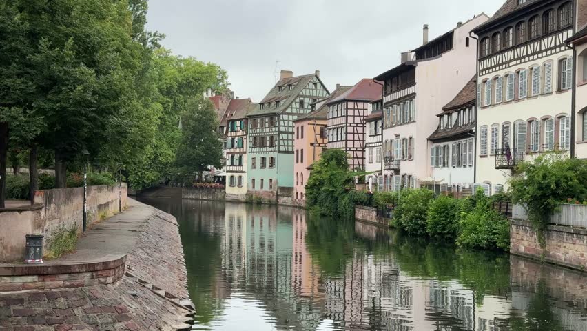 Strasbourg France Riverfront View With Reflections Calm Water Reflects The Colorful Buildings In The Petite