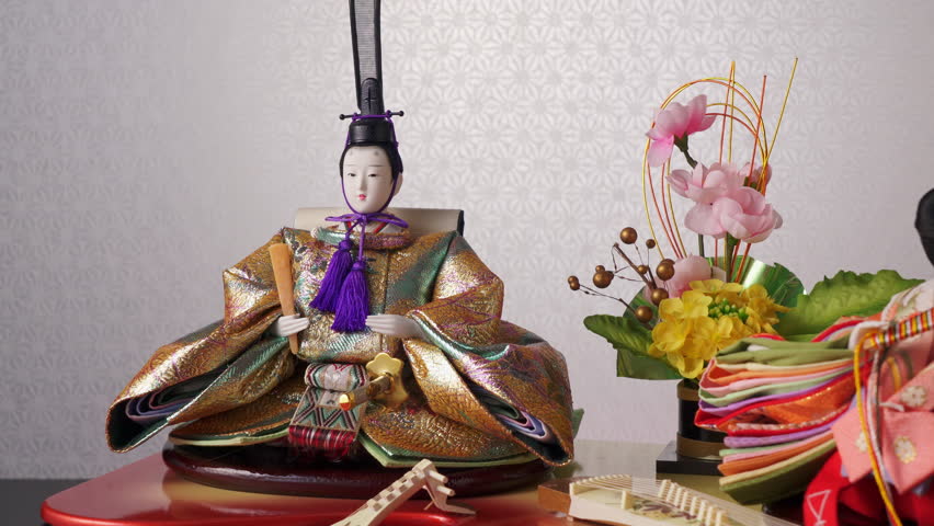 Traditional Japanese Emperor and Empress Hina dolls with miniature musical instruments for Hinamatsuri (Girls