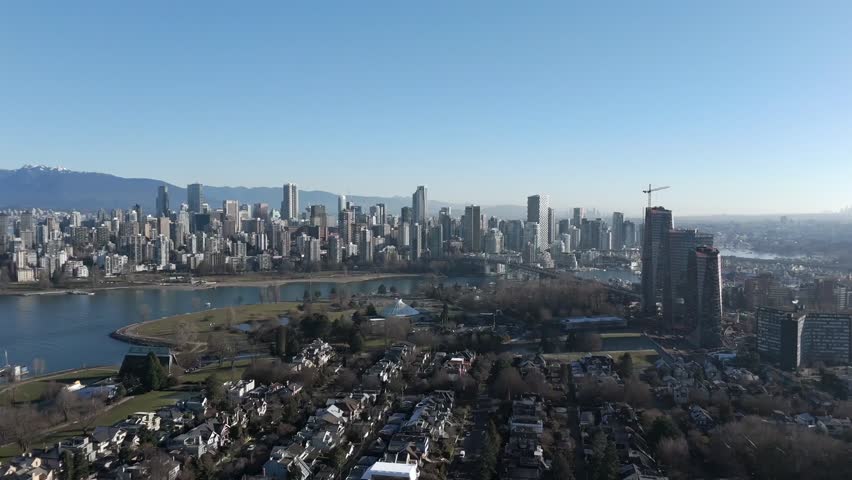 Residential Houses In Kitsilano Overlooking The Downtown Vancouver Skyline In BC, Canada. - aerial shot