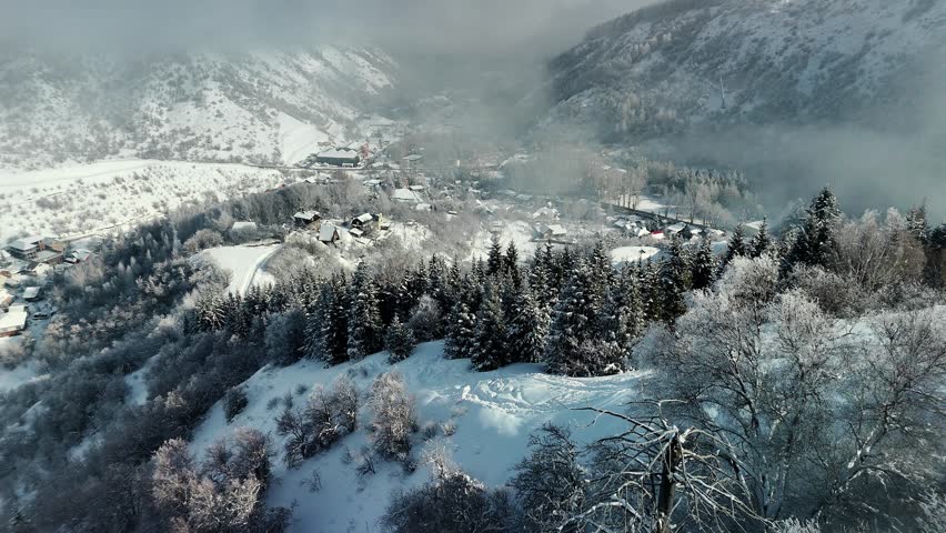 Aerial view of mountain valley with snow