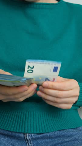 Counting savings and income, woman hands with Euro currency.
