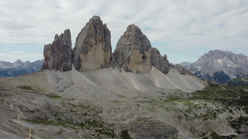Dramatic rocky mountain peaks and alpine landscape under cloudy sky