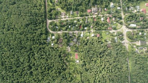Drone Descending Vertical Zoom over Houses