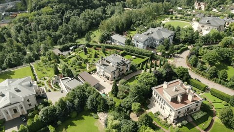 Drone Orbit Over Luxury Homes in Summer