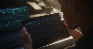 Auto Technician Using Tablet For Engine Diagnostics in Workshop. With Laptop Connected Vehicle, Man Monitors Performance Charts and System Data. Digital Automotive Service and High Tech Maintenance. - Powered by Shutterstock - Get 15% off with code: PIKWIZARD15
