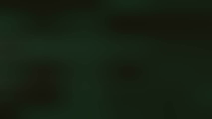 A dark green blurred background with a hint of light