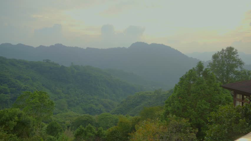 Sunset timelapse over forest mountains in Miaoli, Taiwan with clouds and evening sky.