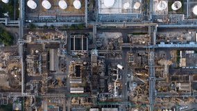 Aerial view of large oil storage tanks at a refinery plant, showcasing industrial operations, pipelines, and energy infrastructure from above. - Powered by Shutterstock - Get 15% off with code: PIKWIZARD15