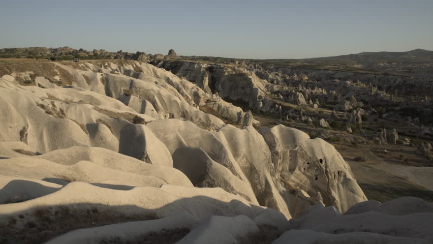 Pan shot of sunset over desert landscape in Cappadocia, Turkey