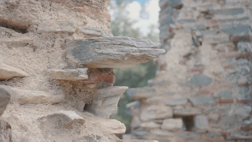 Close-up of ancient stone ruins outdoors on a sunny day