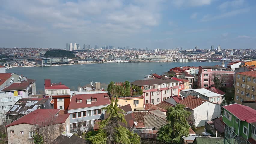 Sunny urban landscape overlooking Istanbul separated by Golden Horn Bay, Turkey
