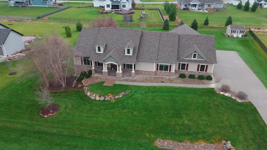Drone footage of a new build mid century modern custom home in Iowa
