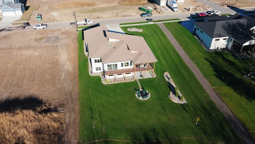 Drone footage of a new build mid century modern custom home in Iowa