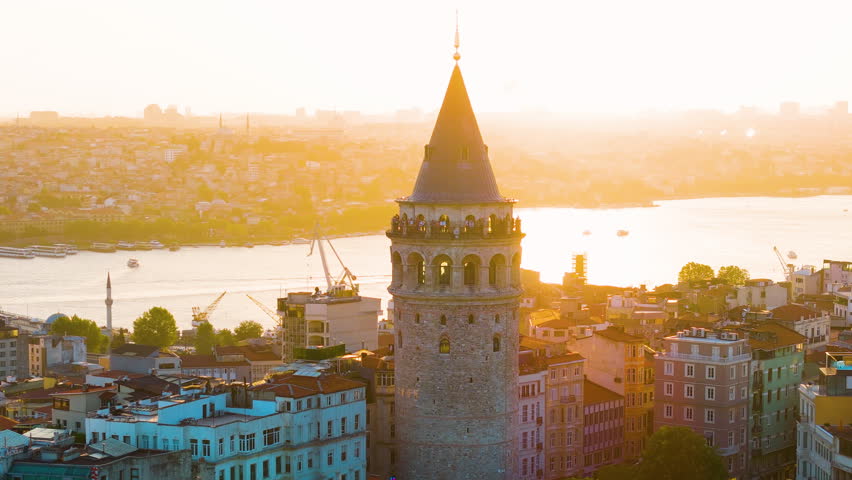 Cinematic aerial shot of Galata Tower at sunset in Istanbul, Turkey