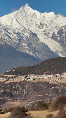 A breathtaking 1080p aerial time-lapse capturing the golden sun rising over the horizon with a vast, flowing sea of clouds filling the mountain valleys in Sichuan, China.