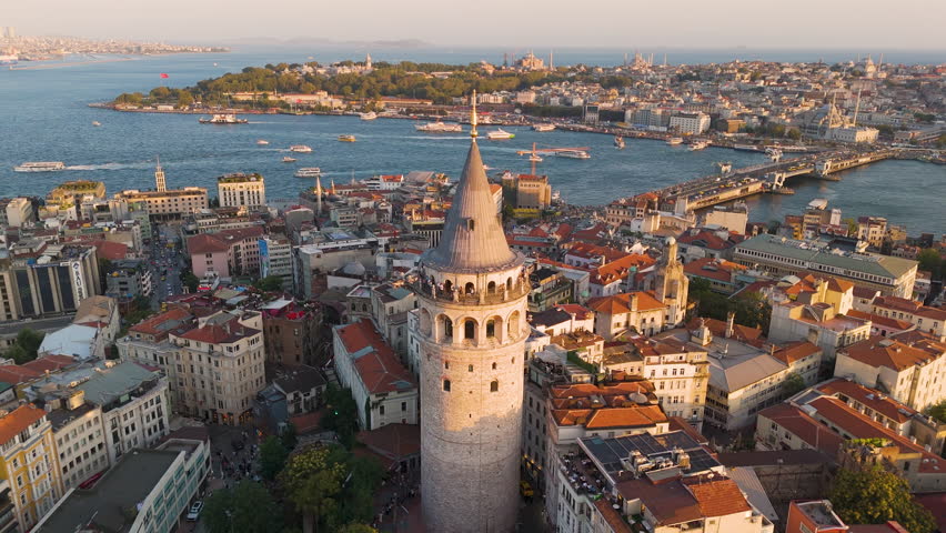 Cinematic aerial shot of Galata Tower at sunset in Istanbul, Turkey