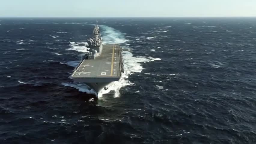 Future amphibious assault ship USS America (LHA-6) sails through the Gulf, demonstrating naval power, advanced technology, and military readiness.