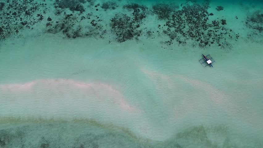 Drone Aerial View of Onok Island, Balabac, Philippines. Tropical Beach, Clear Water, Coral Reefs and Turtles.